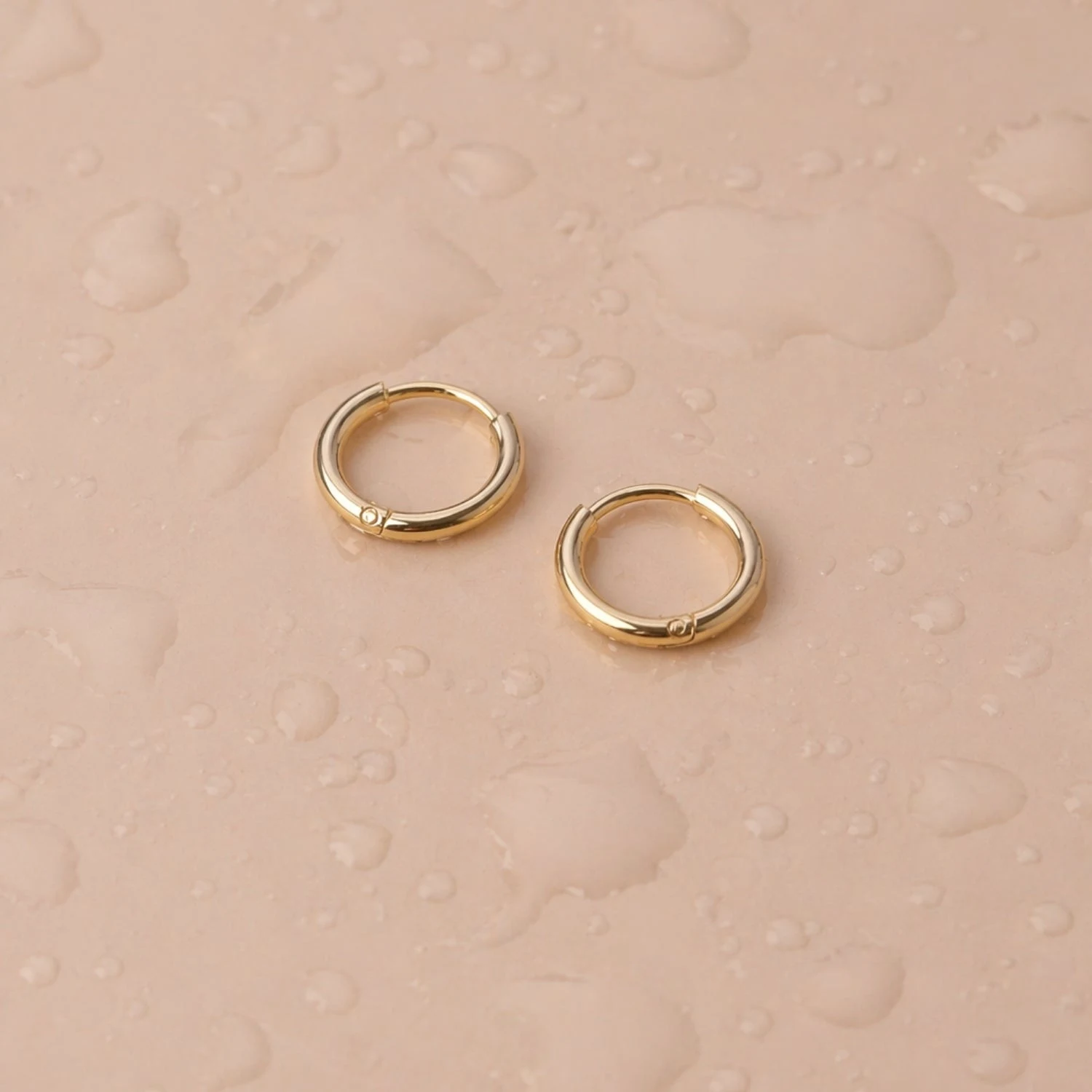Tiny Huggie Hoops - reviewed gold-color source photograph