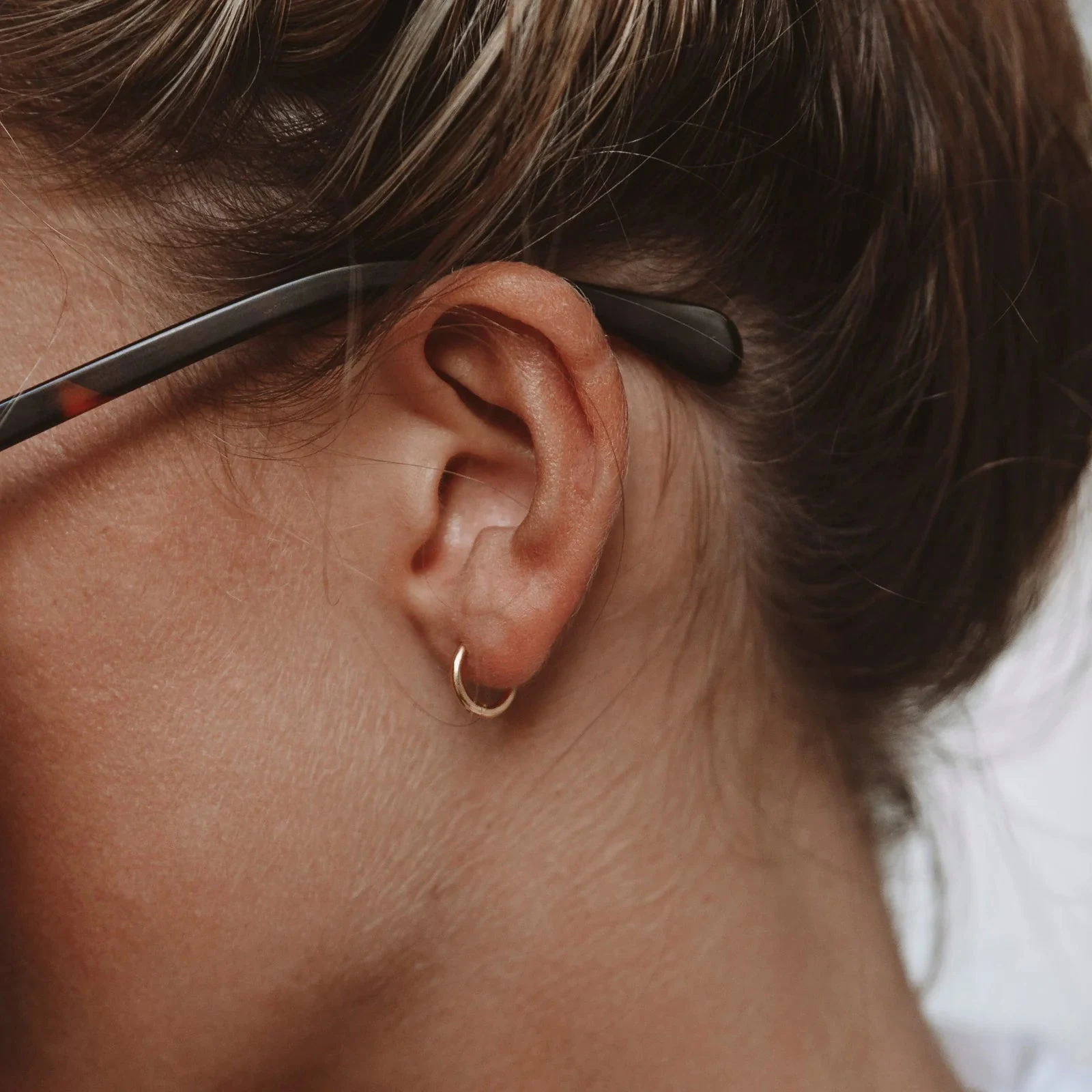 Tiny Huggie Hoops - detail view
