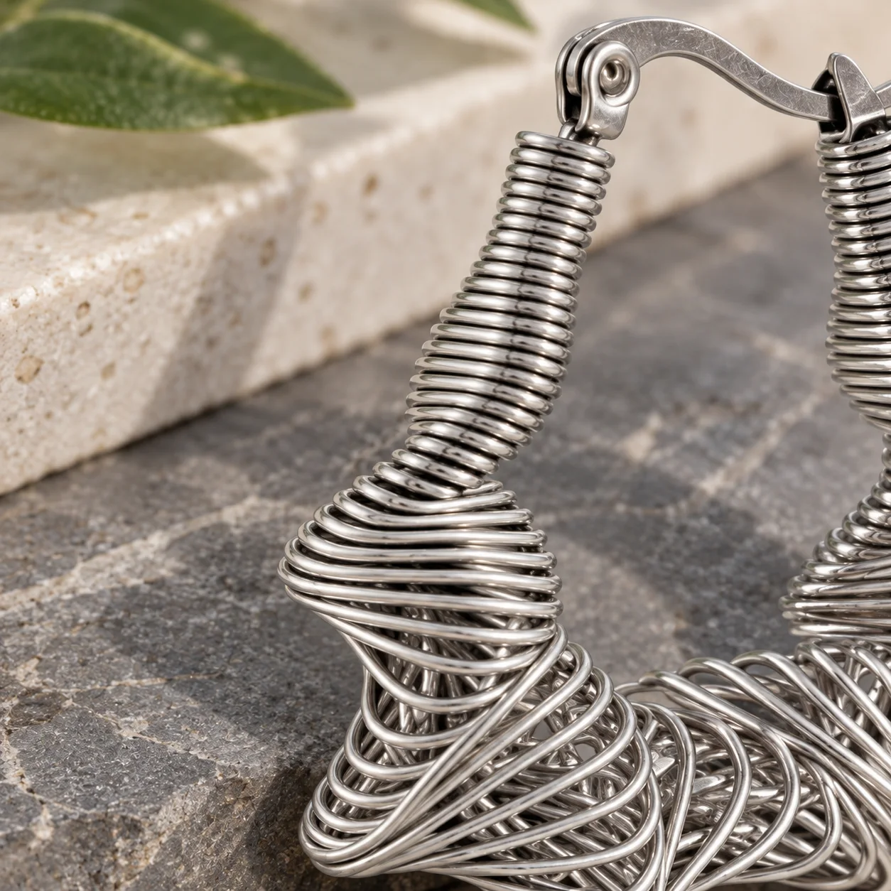 XM SEH0115S silver wire-wrapped star hoop earrings: detail view; styling props not included