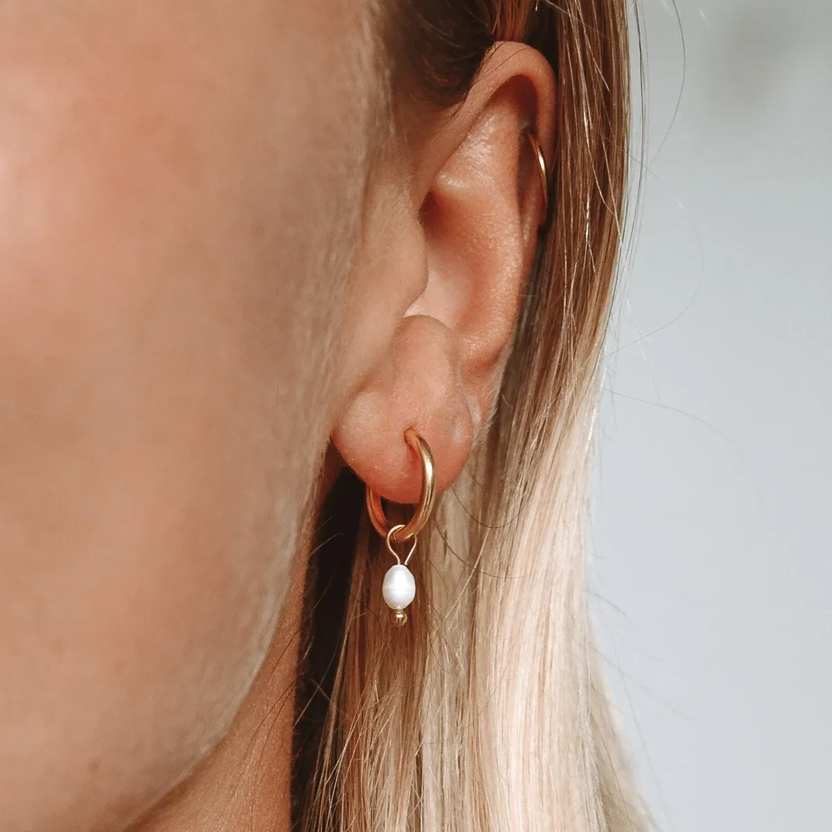 Pearl Huggie Hoops Gold - lead view