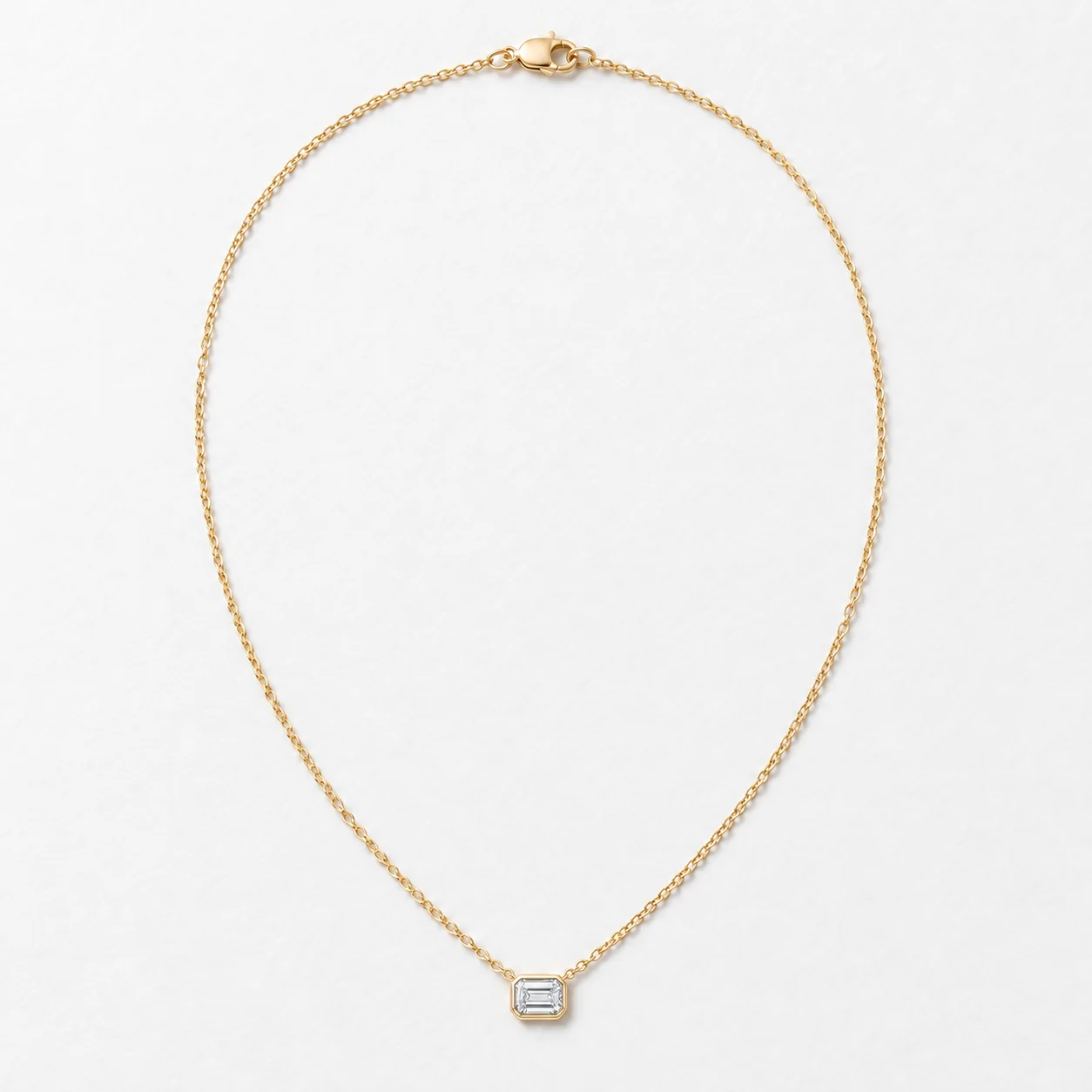 Bezel Moissanite Pendant with fine gold-tone chain