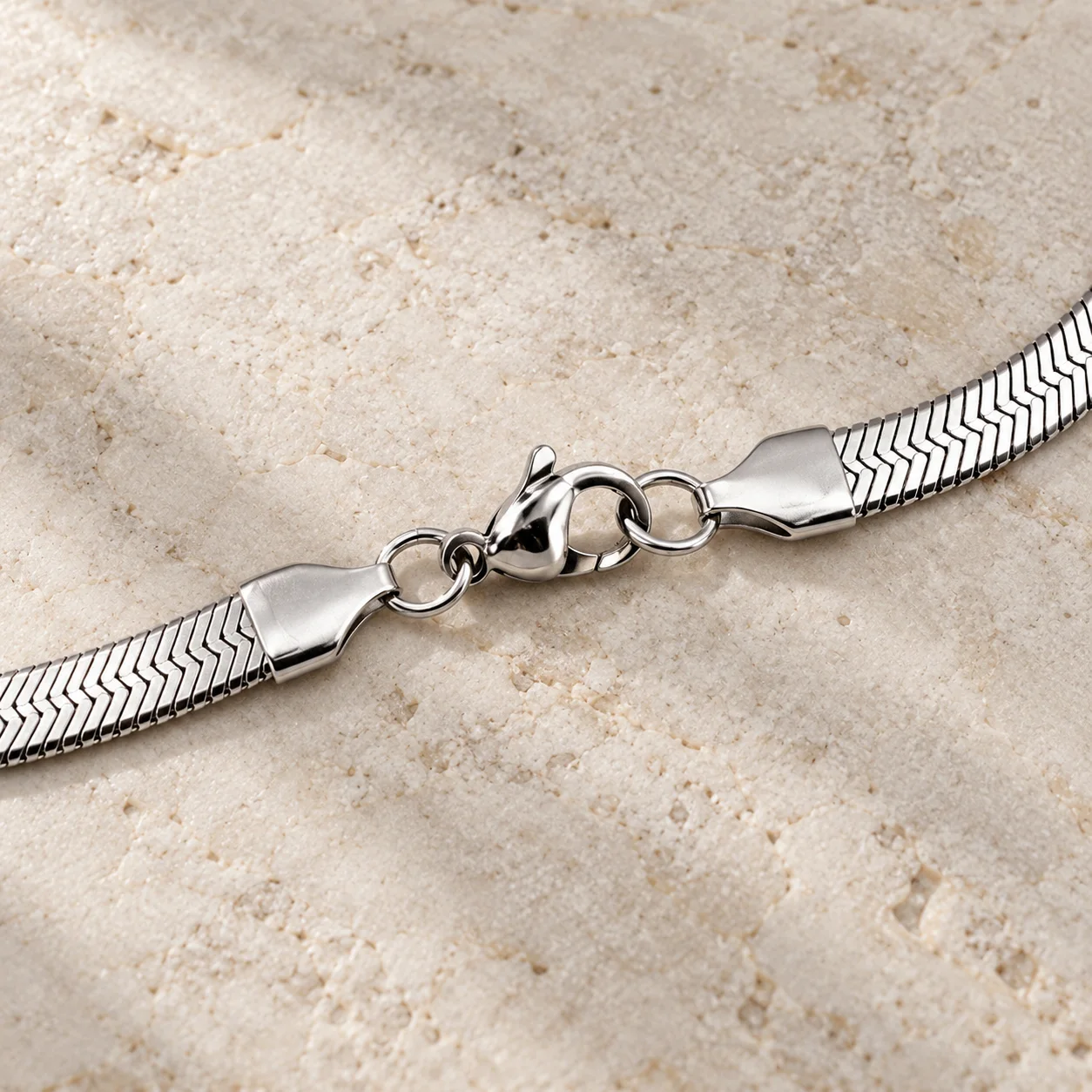 Flat herringbone stainless steel necklace: detail view