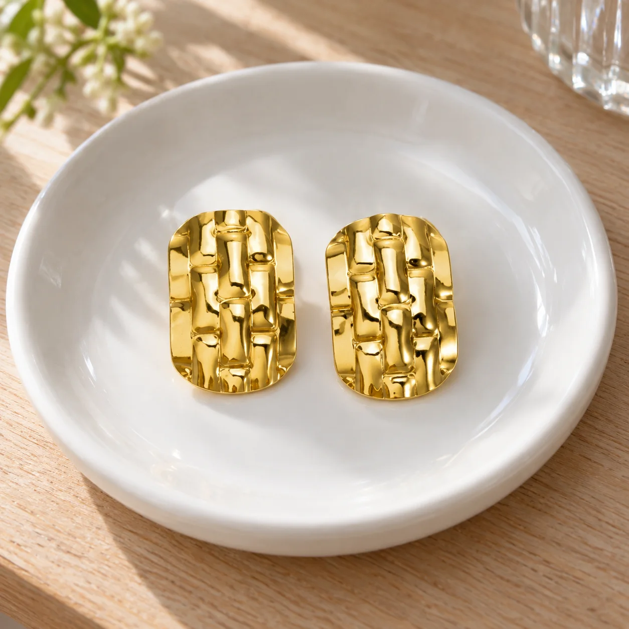 EH060 gold-colored woven rectangular stud earrings: lead view; other styling items not included