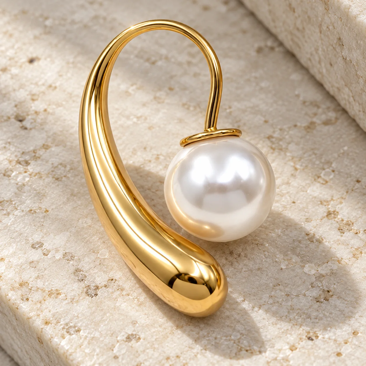 Gold waterdrop shape imitation-pearl earrings: detail view