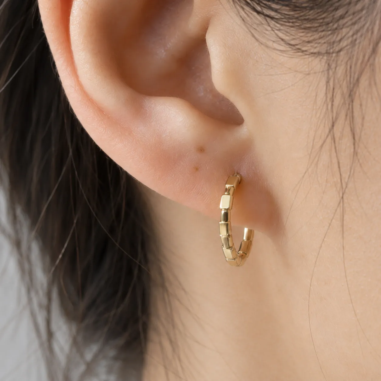 Cora Bamboo Hoops shown in a close worn view