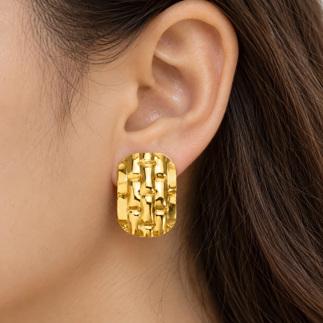 EH060 gold-colored woven rectangular stud earrings: use view; other styling items not included